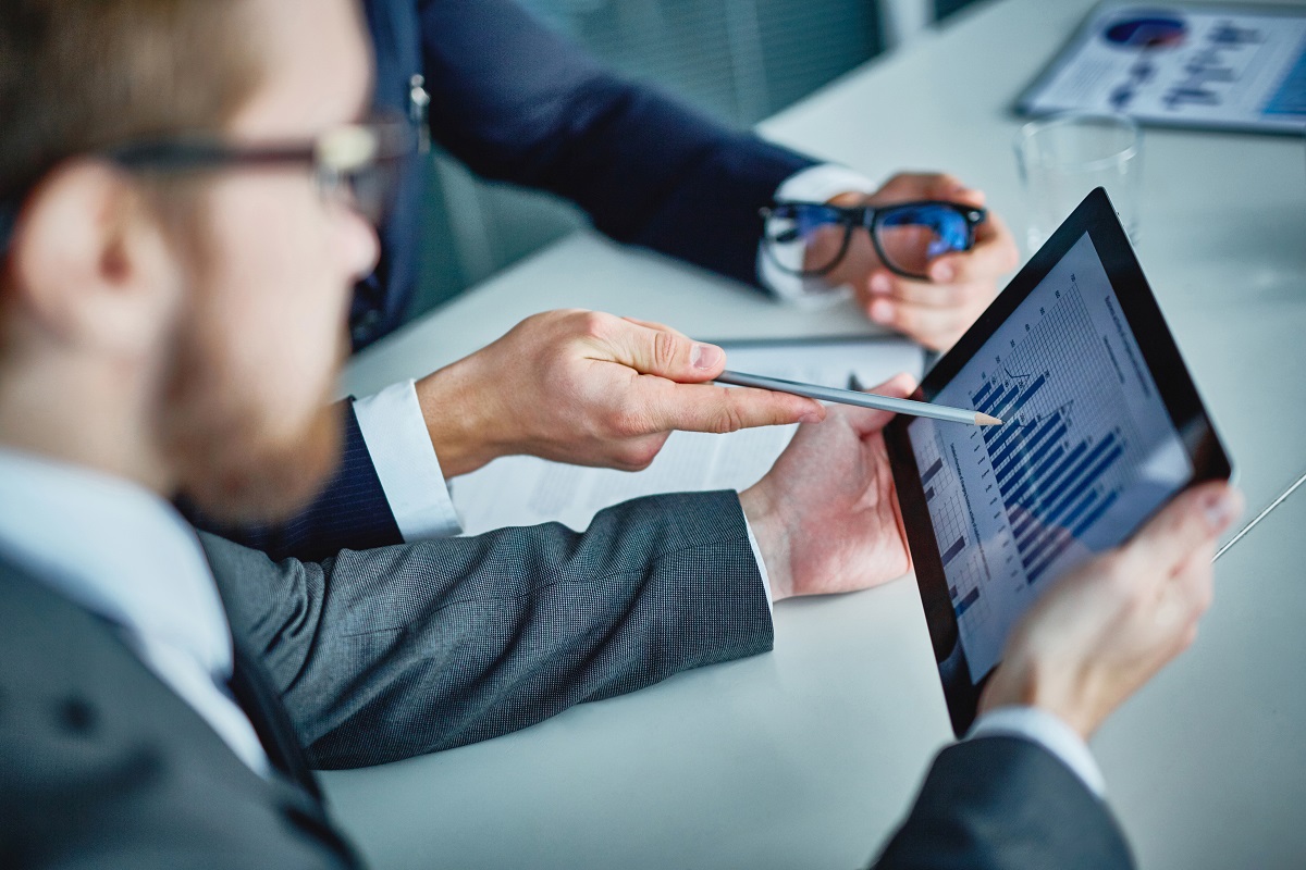 Two business men implementing a new accounting system